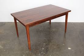 Crafted of walnut veneer, the table epitomizes the clean lines of modern design with a streamlined beveled top. Fantasy Flowers Oktober 1981