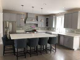 Maybe you would like to learn more about one of these? Gray Kitchen Cabinets With White Quartz Island And Countertops Stone Backsplash And Grey Kitchen Cabinets Grey Quartz Kitchen Countertops Blue Counter Stools