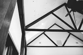 Black paint and wallpaper can emphasize a small area around a ceiling light, ornaments, unique pendant lights or a beautiful chandelier. Black And White Image Of Vaulted Ceiling With Wood Beams Cochrans Lumber