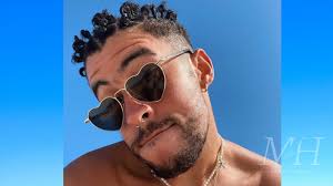Bad bunny offers fan $5,000 for painting | billboard news. Bad Bunny Natural Curly Hair Texture Styled In Bantu Knots