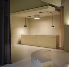 The base of a close to the ceiling light is attached directly to the ceiling. Vibia Tube Ceiling Lamp
