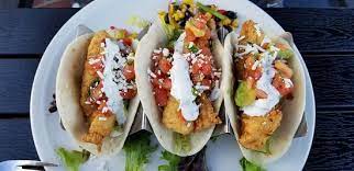 It's a nice atmosphere and although i was born and raised in ca, the restaurant decor reminds me of a movie set. Fish Tacos At Finz Restaurant Salem Ma Picture Of Finz Seafood Grill Salem Tripadvisor