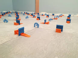 Laying large floor tiles level. Using Tile Leveling Systems Fine Homebuilding