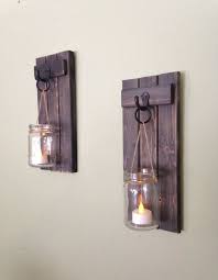 These wooden candle holders seem to have a storied past with their unusual design. Wooden Mason Jar Candle Holder Rustic Wall Sconce Mason Jar Candle Holder Wooden Wall Scon Wooden Candle Holders Rustic Wall Sconces Mason Jar Candle Holders