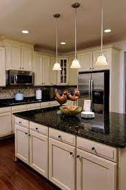 Compact dark brown and cream colors dominated the kitchen with light color granite countertops. 20 Stunning Light Cabinets Dark Countertops Favorite Kitchen Kitchens Kitchendesign Kit Black Kitchen Countertops Dark Kitchen Countertops Dark Countertops