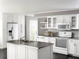 Natural light paired with a white plank ceiling and cabinetry help make the space feel more open. Kitchen Colors With White Appliances Modern Design