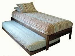 This twin bed boasts a solid pine wood frame and is offered in espresso and natural finishes. Santa Cruz Extra Long Twin Bed With Twin Trundle Rustic Walnut Furniturendecor Com Twin Trundle Bed Trundle Bed Twin Bed Frame
