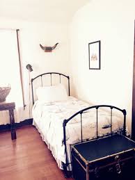 Vintage Farmhouse Boys Room French Linens Black Wrought Iron Twin Bed And White Walls Iron Twin Bed Bed Dream Bedroom