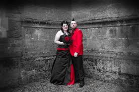 Bring your gothic romance dream wedding to life with our sparkling, ruffled collection of timeless medieval gowns. Red And Black Corset Goth Wedding Dress For Faye Felicity Westmacott
