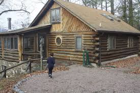 Scorching wood to get the japanese style of burning or scorching of wood. Log Cabin Sand Blasting