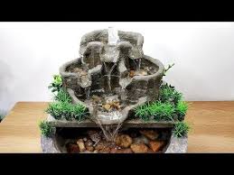 The decorative rocks give it a minimalist and zen feeling, making it perfect for those looking for a sleek, simple design. How To Make Amazing Beautiful Awesome Cemented Waterfall Fountain Water Fountain Youtube Diy Fountain Waterfall Fountain Water Fountain