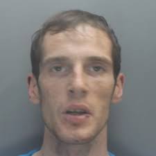 Prolific burglar jailed but is cleared of slashing school caretaker with  knife