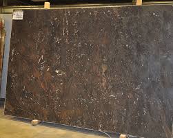 The material displays large flecks, fragments and intrusions in tones of light and dark brown with a washed out look, accentuating the majestic look of the minerals in the popular stone from angola. Granite Northern Arizona Stone Creations