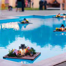 10 Breathtaking Outdoor Lighting Looks For Your Yard Pool Wedding Decorations Pool Wedding Pool Decor