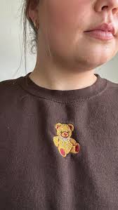 More than a closet staple, it’s a story you wear. Made by Gracie hand-draws  every design, and this teddy sweatshirt is perfection. 🤎🧸✨,  @madebygracieco , #smallbusiness #clothingbrand ...