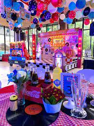 Table decorations, flowers and centerpieces. Diners Retro Night Party Birthday Party Ideas For Kids Retro Birthday Parties Retro Party Themes Retro Birthday