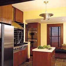 Notice how the oak cabinets in this kitchen are balanced by white walls and sleek gray accents for a polished look. Editors Picks Our Favorite Yellow Kitchens This Old House