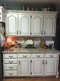 In Expensive Kitchen Cabinet Remodel In Progress White Chalk Paint Brown Antiquing Stain Applied Wi Kitchen Cabinet Remodel Kitchen Cabinets Cabinet Remodel