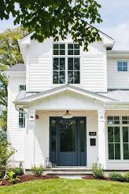 White house with blue door. Modern White Farmhouse Exterior Ideas Pickled Barrel Ranch House Exterior White Farmhouse Exterior White Exterior Houses