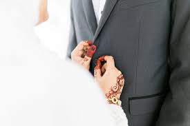 Lovely couple in love holding red paper heart in bed. Muslim Husband And Wife And Their Love Journey About Islam
