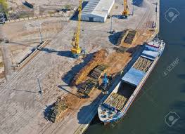 Availability may be affected by your mobile carrier's coverage area. Aerial View On Cargo Ship In Port Bank Loading Wood Stack On Stock Photo Picture And Royalty Free Image Image 123712259