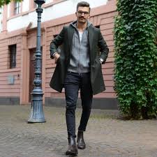 Owning a classic chelsea boot is a must for any gentleman. A Guide To Men S Overcoat How To Buy How To Style A Winter Overcoat Brown Jacket Men Mens Winter Fashion Mens Outfits