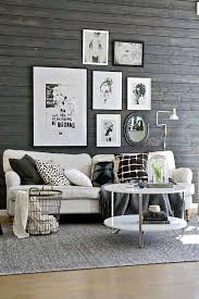 These dominating structures are balanced out with dark accented lounges and sleek a dark grey living room rug balances out the concrete grey feature wall that can be seen inside the bedroom. Breaking Stereotypes With Black Accent Wall Living Room Decoration
