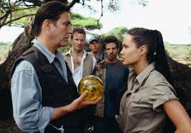 The shapely archaeologist moonlights as a tomb raider to recover lost antiquities and meets her match in the evil powell, who's in search of a powerful relic. Movie Review Tomb Raider The Cradle Of Life The Blade