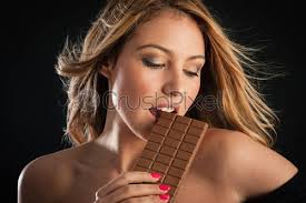Plump titted wifey craves black cock. Sensual Blonde Woman Eating Chocolate Bar Against Black Background Stock Photo Crushpixel