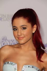 She pulls up a bun on top of her head to make herself look fun and casual. Ariana Grande Hair Ariana Grande S Hairstyles In Pictures Fashion Gone Rogue
