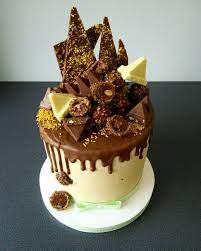 milk chocolate drip cake toblerone and ferrero rocher cute birthday cakes toblerone cake cake