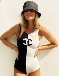 Black And White One Piece Swimsuit The Story Behind The Chanel Logo Chanel Logo Swimsuit Trendy Swimsuits Swimwear Fashion Swimsuits