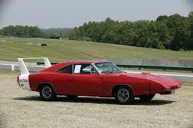 They were built by chrysler to beat ford in the 1970 nascar season. 1969 Dodge Charger Daytona Dodge Supercars Net