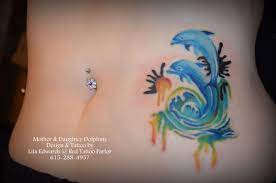 Dual Mother Daughter Dolphin Watercolor Design Tattoo By Lita Edwards Red Tattoo Parlor Tattoos Red Tattoos Dolphin Tattoo For Women