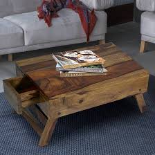 Lift top coffee table is a beautiful and practical table that is designed with a lift top, which can be easily lifted up to have a suitable and comfortable height to use a laptop, write or dine while relaxing on the couch. Laptop Table Upto 30 Off On Laptop Tables Online Latest Designs Urban Ladder