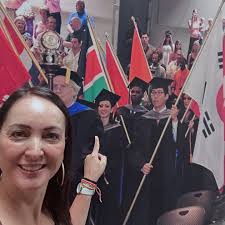 Dr. Brandy Spaulding, Executive Director of the Ohio State Chiropractic  Association, presenting the 2020 Ohio Chiropractic Foundation Anniversary  Scholarship check in the amount of $5,000 to Marcus Hummel, a 12th Quarter  DC