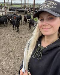 someone wearing a big hat.. who's the guy? farmer, cowboy or..?