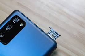 The sim card is on the bottom side of a carrier beneath the battery compartment. How To Insert And Remove Sim Card From Samsung Galaxy S20 Fe Technipages