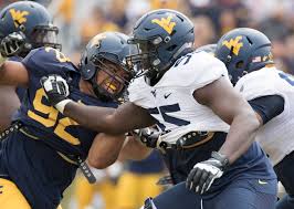 Yodny cajuste (born february 21, 1996) is an american football offensive tackle for the new england patriots of the national football league (nfl). Cajuste Continues The Happy Returns For West Virginia Wv Metronews