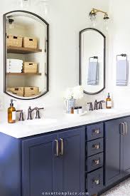 Featuring old world designed hardware as manufactured by coastal bronze, this custom gate a custom navy blue kitchen in lubbock, tx featuring the brushed brass square bar series hardware. Small Bathroom Remodel Reveal Navy Neutral On Sutton Place