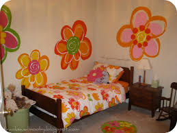 Featuring with garden fairies, toadstool cottages, a big tree with tree houses, birds, flowers, butterflies etc features: Remodelaholic Hand Painted Flowers For Little Girls Room