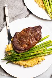 What is the cooking temperature for bison? Bison Ribeye Steaks With Asparagus And Buttery Yukon Gold Potatoes Recipes