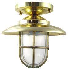 It comes in a brilliant solid brass finish for a stylish look of luxury. Nautical Flush Ceiling Light Solid Brass Interior Exterior By Shiplights Beach Style Outdoor Flush Mount Ceiling Lighting By Shiplights Houzz