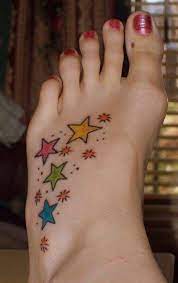 Thinking Of Something Similar On My Foot With Colors Representing Mine My Husband S And Both My Daug Star Foot Tattoos Small Star Tattoos Star Tattoo Designs