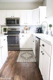 How Our Laminate Floors Are Holding Up Almost 2 Years Later House By Hoff House Flooring White Kitchen Decor Wood Laminate Flooring