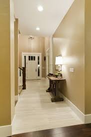 Light Tile With A Seamless Transition To Dark Wood Floor Perfect Living Room Wood Floor Dark Wood Floors Entryway Tile