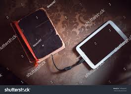 Ebook Or Tablet Pc Ebook Reader And Old Book Connected With Cable Tablet Download Information From In 2020 New Technology Gadgets Technology Gifts Future Technology