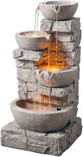 They include water pumps to keep water moving throughout the fountain safely and can be easily added to most outdoor decorating schemes. Amazon Com Peaktop 201601pt Water 4 Tiered Bowls Floor Stacked Stone Waterfall Fountain With Led Lights And Pump For Outdoor Patio Garden Backyard Decking Decor 33 Inch Height Gray 33 Garden Outdoor