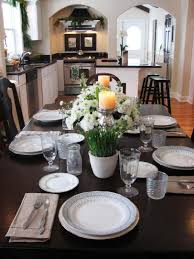 Small flower arrangements scattered down the length of the table work great if you serve your meal buffet style, or plate dinner in the kitchen before bringing it to the table. Kitchen Table Centerpiece Design Ideas Hgtv Pictures Hgtv