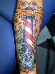 The lighthouse tattoo on the upper left arm with a dark color will camouflage with the light kin body to give swagger look. 30 Beautiful Lighthouse Tattoos On Forearm